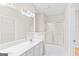 Clean white bathroom features a double vanity and glass-enclosed shower at 161 Spring Creek Blvd, Mcdonough, GA 30253