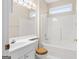 Bright white bathroom features tub and shower with window to maximize natural light at 161 Spring Creek Blvd, Mcdonough, GA 30253