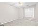 Neutral bedroom with carpet, fan, and natural light from a window at 161 Spring Creek Blvd, Mcdonough, GA 30253