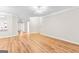 Open living room featuring hardwood floors, recessed lighting and open access to kitchen at 161 Spring Creek Blvd, Mcdonough, GA 30253