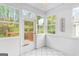 Bright sun room features white tile flooring, lots of natural light and exterior access at 161 Spring Creek Blvd, Mcdonough, GA 30253