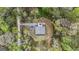 Aerial view of private modern home nestled within a lush canopy of trees at 803 Bentley Hill Rd, Stockbridge, GA 30281