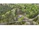 A peaceful home nestled amongst the trees with a long winding driveway leading to the secluded property at 803 Bentley Hill Rd, Stockbridge, GA 30281