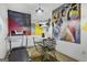 Finished basement with treadmill, TV, concrete floors, and decorative artwork at 803 Bentley Hill Rd, Stockbridge, GA 30281