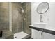 Contemporary bathroom features a walk-in shower with dark tile and a modern vessel sink at 803 Bentley Hill Rd, Stockbridge, GA 30281