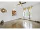 A bright, empty bedroom featuring concrete floors, modern wall art and a ceiling fan at 803 Bentley Hill Rd, Stockbridge, GA 30281