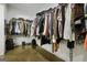 Spacious walk-in closet with ample hanging space and shelving for organization at 803 Bentley Hill Rd, Stockbridge, GA 30281