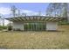 A modern single-story home, with walls of windows, surrounded by trees at 803 Bentley Hill Rd, Stockbridge, GA 30281