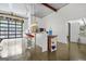 Bright kitchen offers bar seating, garage-door window, and easy access to indoor-outdoor entertaining at 803 Bentley Hill Rd, Stockbridge, GA 30281