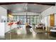 Open-concept living area featuring natural light, a modern bar, and a spacious seating area at 803 Bentley Hill Rd, Stockbridge, GA 30281