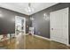 A room featuring gray walls, concrete floors, with a doorway leading to additional living space at 803 Bentley Hill Rd, Stockbridge, GA 30281