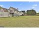 Sprawling backyard featuring a well-maintained lawn, privacy fence, and ample space for recreation at 198 Crestwood Rd, Tyrone, GA 30290