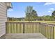 View of the spacious backyard from the wooden deck, showcasing the beautiful scenery at 198 Crestwood Rd, Tyrone, GA 30290