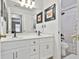 Bright bathroom featuring a double vanity, framed mirrors, and a shower-tub combination at 198 Crestwood Rd, Tyrone, GA 30290