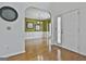 Dining room featuring hardwood floors and an elegant chandelier, leading to the front door at 198 Crestwood Rd, Tyrone, GA 30290
