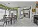 Bright dining area featuring a large table with seating for six and direct access to the kitchen at 198 Crestwood Rd, Tyrone, GA 30290