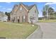 Angle view of brick home, featuring a garage and a concrete driveway at 198 Crestwood Rd, Tyrone, GA 30290