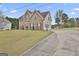 Side view of brick home, featuring a garage and a concrete driveway at 198 Crestwood Rd, Tyrone, GA 30290