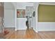 Bright foyer with hardwood floors and a view into the living room at 198 Crestwood Rd, Tyrone, GA 30290