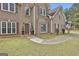 Brick home featuring an elegant front door with topiaries and manicured bushes at 198 Crestwood Rd, Tyrone, GA 30290