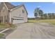 Side view of garage and concrete driveway in the yard at 198 Crestwood Rd, Tyrone, GA 30290