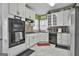 Well-equipped kitchen features updated appliances, plenty of storage, and stylish backsplash at 198 Crestwood Rd, Tyrone, GA 30290