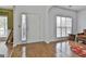 Bright living room featuring wood floors, white walls and large windows at 198 Crestwood Rd, Tyrone, GA 30290