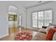 Cozy living room featuring hardwood floors, stylish decor, and an arched entryway at 198 Crestwood Rd, Tyrone, GA 30290