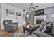 Cozy living room featuring a fireplace, hardwood floors, and ample seating at 198 Crestwood Rd, Tyrone, GA 30290
