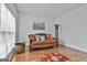 Comfortable living room showcasing hardwood floors, brown sofa, and natural light at 198 Crestwood Rd, Tyrone, GA 30290