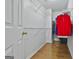 Spacious walk-in closet with hardwood floors and white walls with adjustable wire shelving for organization at 198 Crestwood Rd, Tyrone, GA 30290