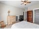Spacious bedroom featuring a ceiling fan, closet, dresser, television, and neutral wall color at 5124 N Pratt St, Covington, GA 30014