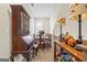 Cozy dining area with a wooden table set and vintage decor, illuminated by a decorative lamps at 5124 N Pratt St, Covington, GA 30014