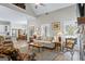 Open-concept living room with fireplace, hardwood floors, and plenty of seating at 5124 N Pratt St, Covington, GA 30014