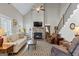 Spacious living room with fireplace, high ceilings, and staircase at 5124 N Pratt St, Covington, GA 30014