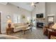 Bright living room with fireplace, neutral decor, and large windows at 5124 N Pratt St, Covington, GA 30014