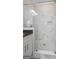 Beautifully tiled shower features a built-in niche and a glass enclosure, creating a spa-like experience at 5124 N Pratt St, Covington, GA 30014