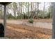 Spacious backyard, ready for landscaping, backs to a wooded area providing ample privacy at 702 Las Brasis Ct, Peachtree City, GA 30269