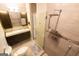 Modern bathroom featuring a sleek double vanity and glass-enclosed shower with rainfall showerhead at 702 Las Brasis Ct, Peachtree City, GA 30269