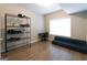 Bright bedroom with ample sunlight and wood flooring at 702 Las Brasis Ct, Peachtree City, GA 30269