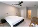Comfortable bedroom with carpet, a ceiling fan, and natural light at 702 Las Brasis Ct, Peachtree City, GA 30269