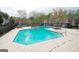 Community swimming pool with lounge chairs provides a relaxing outdoor amenity for residents at 702 Las Brasis Ct, Peachtree City, GA 30269