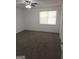 Comfortable bedroom with plush carpeting, a ceiling fan, and a window at 1172 Sheffield Ct, Jonesboro, GA 30238