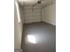 Clean and bright garage featuring a neutral-colored floor and a white garage door at 1172 Sheffield Ct, Jonesboro, GA 30238