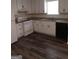 Kitchen with granite countertops, white cabinets, and modern appliances at 1172 Sheffield Ct, Jonesboro, GA 30238