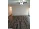 Spacious living room with wood-look flooring and a door leading to the outside at 1172 Sheffield Ct, Jonesboro, GA 30238