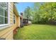 Lush green backyard with a screened-in porch, offering a serene and private outdoor space at 4050 Old Fairburn Rd, Atlanta, GA 30349