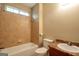 Tiled bathroom features a shower-tub combo, and granite vanity at 4050 Old Fairburn Rd, Atlanta, GA 30349