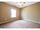 Spacious bedroom with carpet floors, a window for natural light, and a ceiling fan at 4050 Old Fairburn Rd, Atlanta, GA 30349