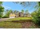 Spacious home featuring a two-car garage, a mix of brick and siding, and a neatly landscaped front yard at 4050 Old Fairburn Rd, Atlanta, GA 30349